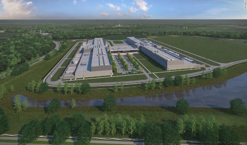 Aerial view of data center campus by river